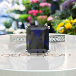 Load image into Gallery viewer, Celebrate Timeless Beauty: Adorned with 4.0ct Emerald Cut Blue Sapphire in Solitaire Setting