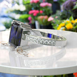 Load image into Gallery viewer, Celebrate Timeless Beauty: Adorned with 4.0ct Emerald Cut Blue Sapphire in Solitaire Setting
