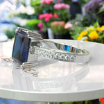 Load image into Gallery viewer, Deep Blue Majesty: 4.0ct Emerald Cut London Blue Topaz Ring.