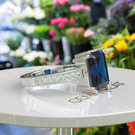 Load image into Gallery viewer, Deep Blue Majesty: 4.0ct Emerald Cut London Blue Topaz Ring.