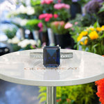 Load image into Gallery viewer, Deep Blue Majesty: 4.0ct Emerald Cut London Blue Topaz Ring.
