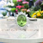 Load image into Gallery viewer, Vibrant Elegance Unleashed: Celebrate with an Oval Peridot Center in This Halo Ring