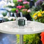 Load image into Gallery viewer, Green Majesty Meets Brilliance: Asscher Cut Green Emerald Ring, Enveloped in Moissanite Baguette Halo