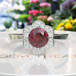 Load image into Gallery viewer, Blossoming Passion: Round Ruby Ring with Floral-Styled Halo