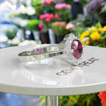 Load image into Gallery viewer, Blossoming Passion: Round Ruby Ring with Floral-Styled Halo