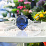 Load image into Gallery viewer, Captivating Oval London Blue Topaz and Moissanite Accent Gemstone Ring