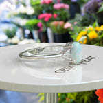 Load image into Gallery viewer, Classic Oval Opal Ring with Lustrous Moissanite Side Stones