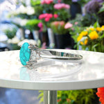 Load image into Gallery viewer, Mesmeric Blue: Oval Turquoise Ring with Brilliant Moissanite Companions.