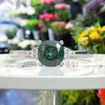 Load image into Gallery viewer, Garden of Radiance: Deep Green Cushion-Cut Emerald with Dazzling Moissanite Edges.