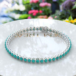 Load image into Gallery viewer, Eternal Ocean: 3.0mm Round Turquoise 5.0ct Tennis Bracelet Elegance
