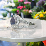 Load image into Gallery viewer, Celestial Dance: Round Alexandrite Halo Ring Complemented by Moissanite Accents in Lustrous Silver
