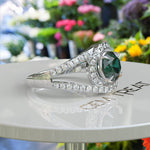 Load image into Gallery viewer, Verdant Elegance: Lustrous Round Green Emerald Surrounded by Dazzling Halo
