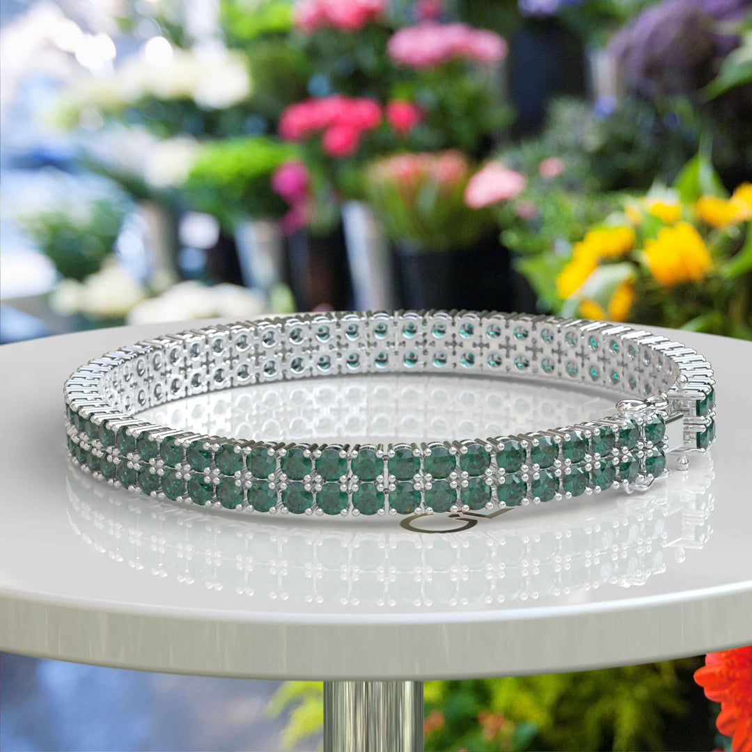 Enchanted Gleam: 12.0ct Round Green Emerald Tennis Bracelet Elegance