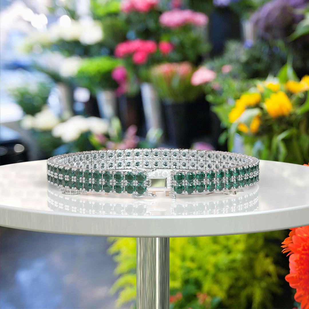 Enchanted Gleam: 12.0ct Round Green Emerald Tennis Bracelet Elegance