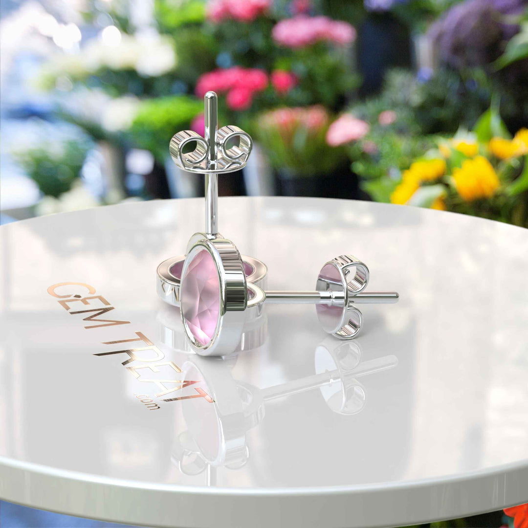 Gentle Radiance: Classic Round Rose Quartz Earrings in Bezel Setting.