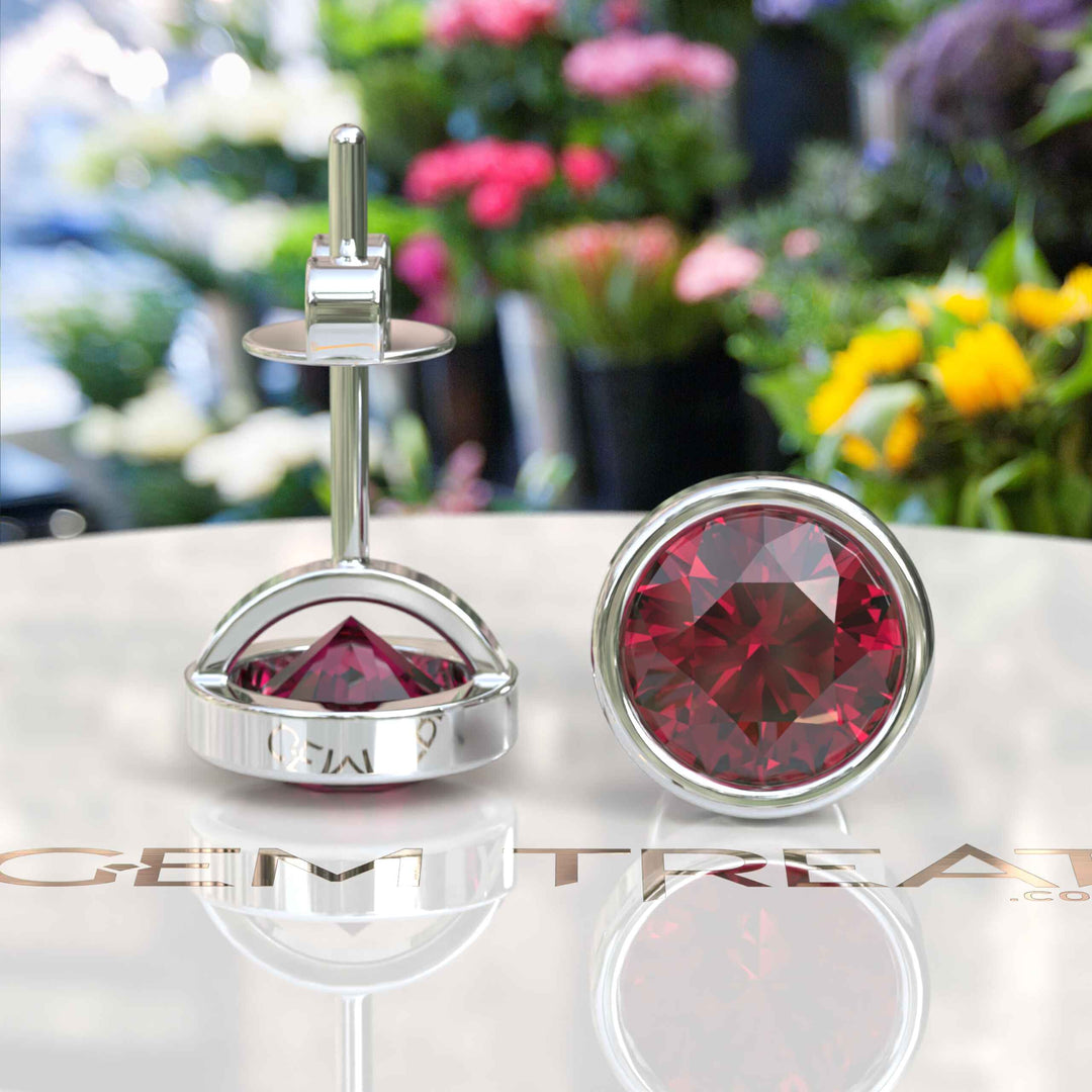 Ruby Radiance: Classic Bezel Set Round Stud Earrings.