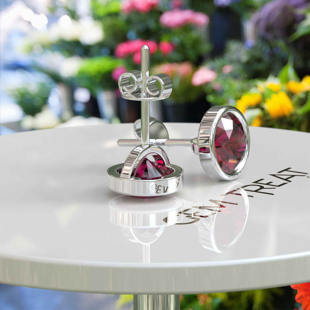 Ruby Radiance: Classic Bezel Set Round Stud Earrings.