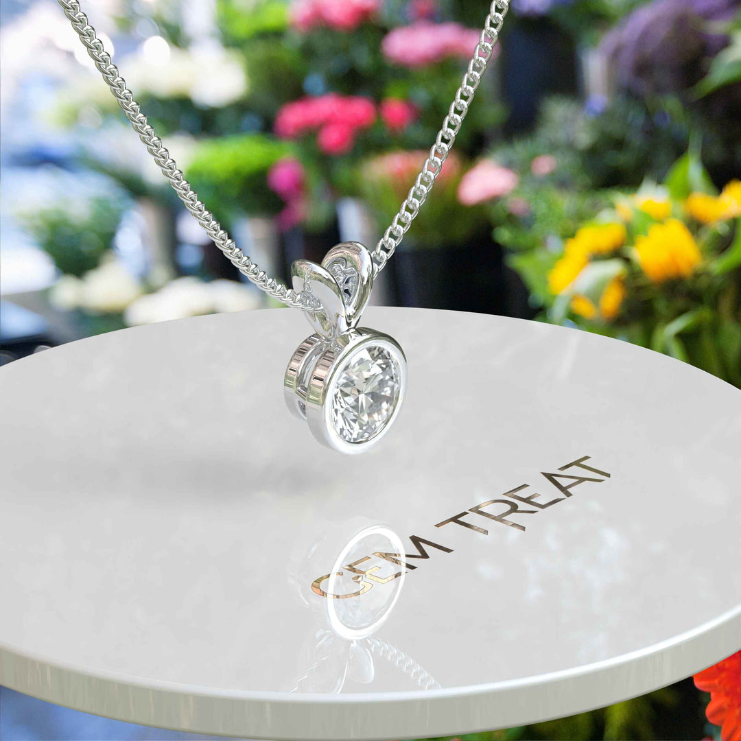 Glistening Gem: Bezel Set, A Round White Moissanite Solitaire Pendant Necklace of Pure Brilliance