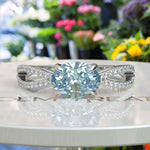 Load image into Gallery viewer, Crystal Clear Love: Lustrous Silver Ring with 1ct Oval Aquamarine and Dazzling Moissanites Split Shank Details
