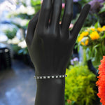 Load image into Gallery viewer, Contrast Charm: Round Black Onyx &amp; Moissanite Sparkle Tennis Bracelet
