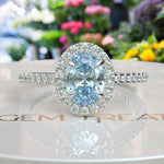 Load image into Gallery viewer, Bridal Elegance in Sea Tones: Oval Aquamarine Halo Engagement Ring&#39;s Ethereal Beauty
