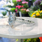 Load image into Gallery viewer, Bridal Elegance in Sea Tones: Oval Aquamarine Halo Engagement Ring&#39;s Ethereal Beauty
