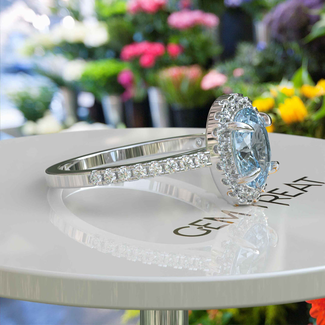 Bridal Elegance in Sea Tones: Oval Aquamarine Halo Engagement Ring's Ethereal Beauty