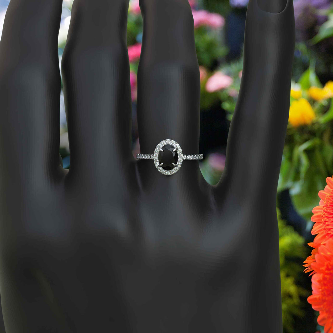 Dark Allure: Lustrous Silver Ring with Oval Black Onyx Centerpiece, Accented by Radiant Moissanites