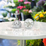 Load image into Gallery viewer, Glistening Gala: Round White Moissanite Stud Earrings with Milgrain Halo.
