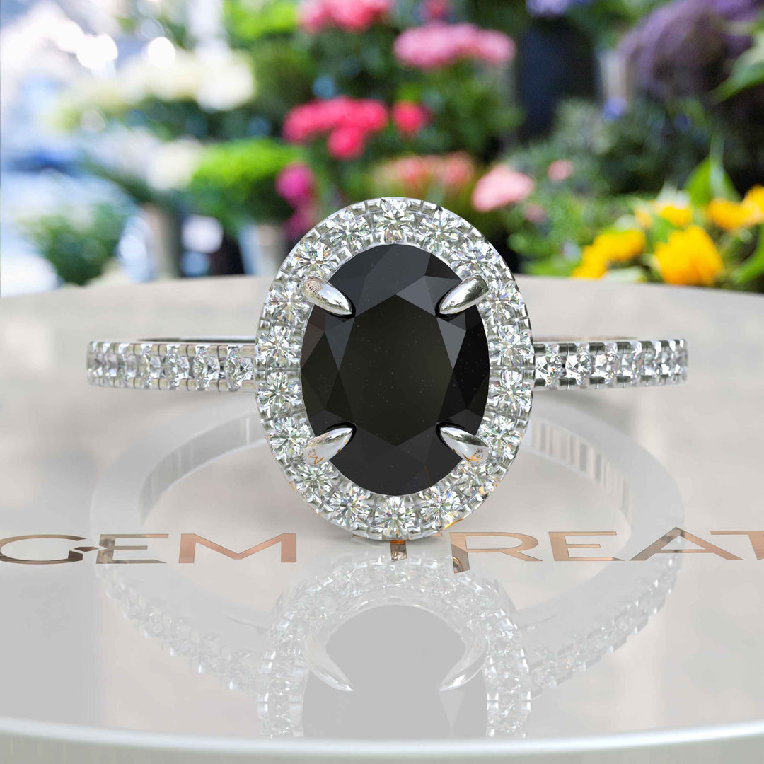 Dark Allure: Lustrous Silver Ring with Oval Black Onyx Centerpiece, Accented by Radiant Moissanites