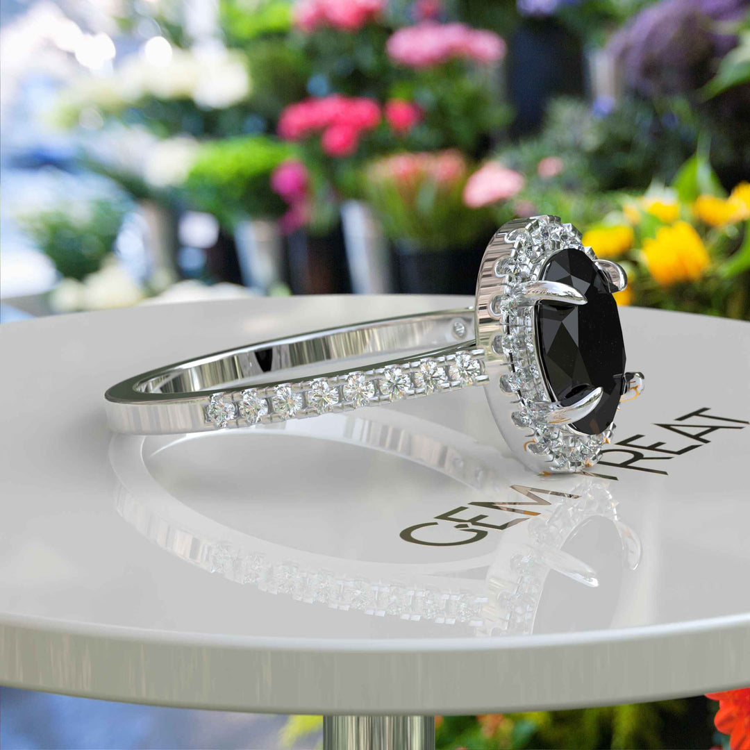 Dark Allure: Lustrous Silver Ring with Oval Black Onyx Centerpiece, Accented by Radiant Moissanites