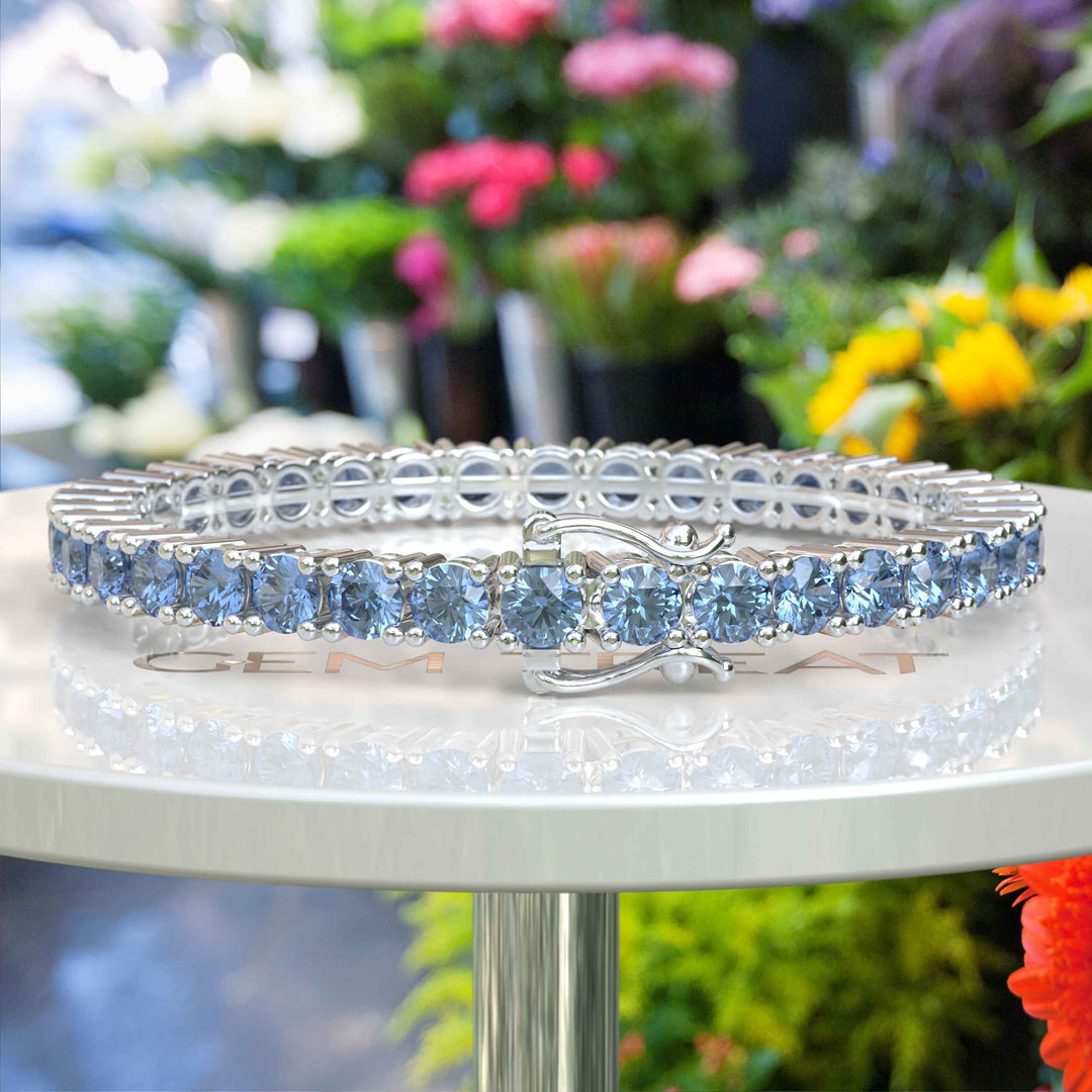 Lustrous Waves: A 16.0ct, 5.0mm Blue Moissanite Tennis Bracelet Marvel