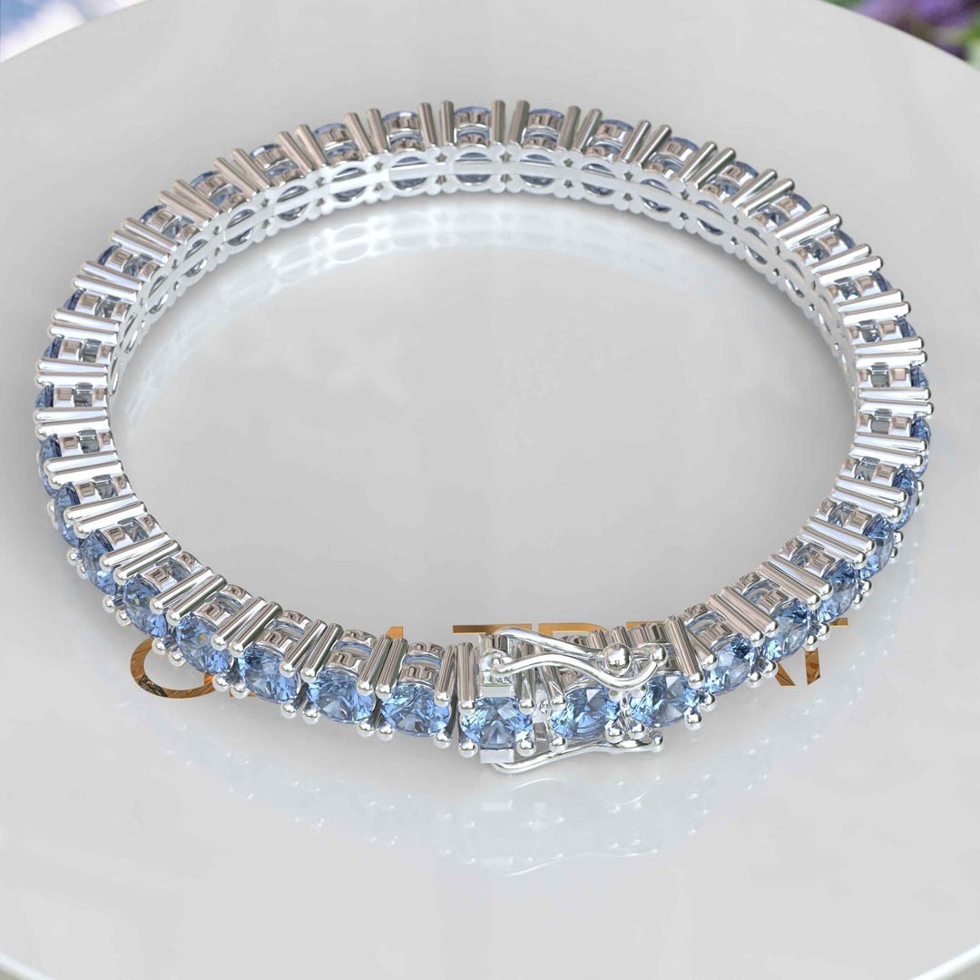 Lustrous Waves: A 16.0ct, 5.0mm Blue Moissanite Tennis Bracelet Marvel