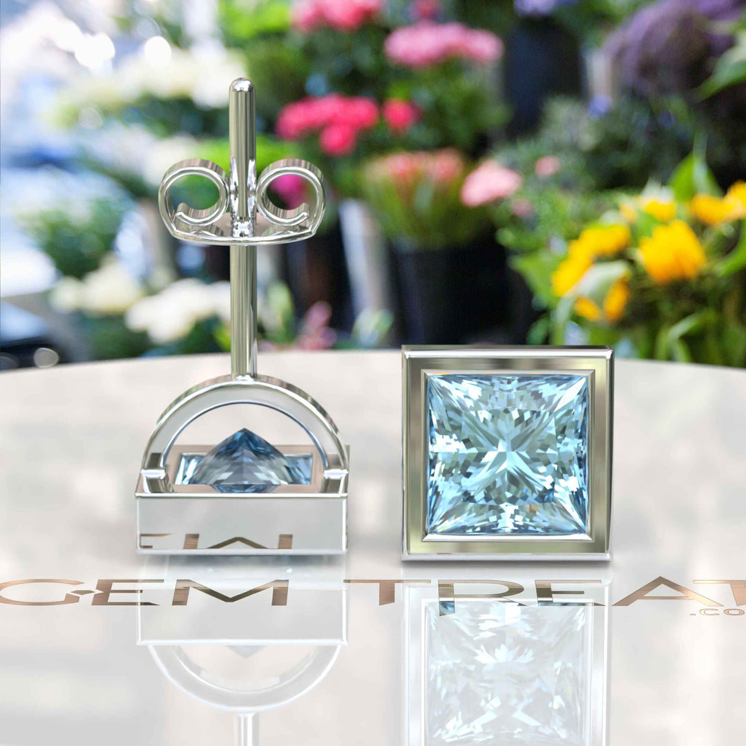 Crystal Clear Beauty: Stud Earrings Featuring Princess Cut Aquamarine in Bezel Design