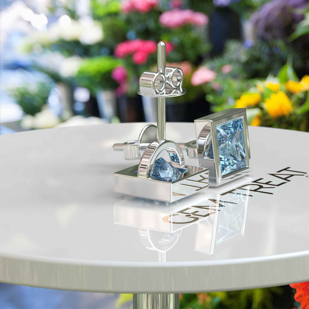 Crystal Clear Beauty: Stud Earrings Featuring Princess Cut Aquamarine in Bezel Design