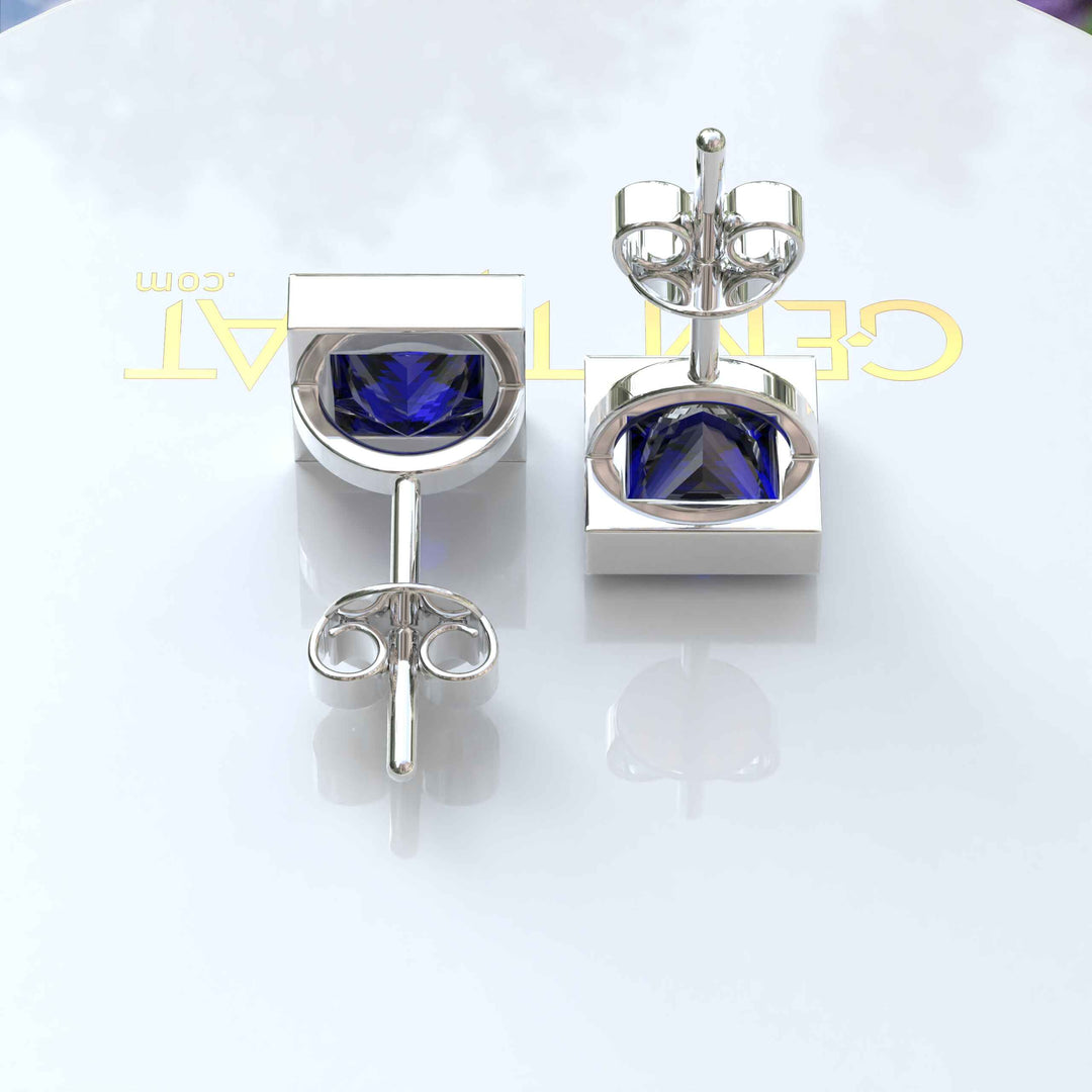 Earrings of Royalty: Bezel-Encased Princess Cut Blue Sapphire Studs.