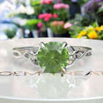 Load image into Gallery viewer, Green Gem Enigma: Round Peridot Solitaire in Celtic Silver Setting
