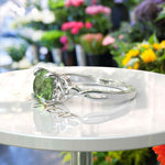 Load image into Gallery viewer, Green Gem Enigma: Round Peridot Solitaire in Celtic Silver Setting
