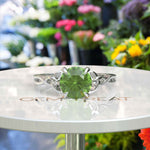 Load image into Gallery viewer, Green Gem Enigma: Round Peridot Solitaire in Celtic Silver Setting
