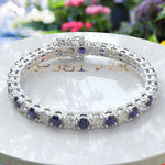 Load image into Gallery viewer, Sapphire Elegance: 5.0mm Alternating Blue Sapphire &amp; Moissanite Tennis Bracelet
