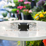 Load image into Gallery viewer, Dark Gem Allure: Emerald Cut 1.5ct Black Onyx Silver Ring with Artfully Twisted Shank
