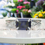 Load image into Gallery viewer, Enchanting Emerald Cut Blue Sapphire Ring - Twisted Band of Love
