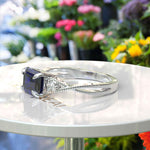 Load image into Gallery viewer, Enchanting Emerald Cut Blue Sapphire Ring - Twisted Band of Love
