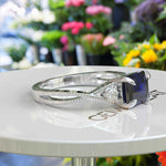 Load image into Gallery viewer, Enchanting Emerald Cut Blue Sapphire Ring - Twisted Band of Love
