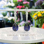 Load image into Gallery viewer, Sapphire Serenade: Pear Cut Blue Sapphire Earrings in a Graceful Drop Design.
