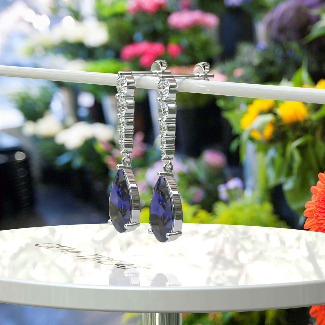 Sapphire Serenade: Pear Cut Blue Sapphire Earrings in a Graceful Drop Design.