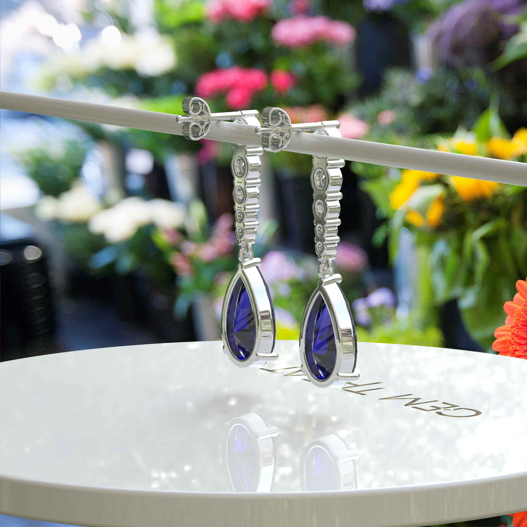 Sapphire Serenade: Pear Cut Blue Sapphire Earrings in a Graceful Drop Design.