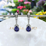 Load image into Gallery viewer, Sapphire Serenade: Pear Cut Blue Sapphire Earrings in a Graceful Drop Design.
