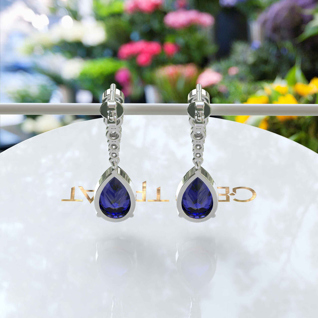 Sapphire Serenade: Pear Cut Blue Sapphire Earrings in a Graceful Drop Design.