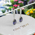 Load image into Gallery viewer, Sapphire Serenade: Pear Cut Blue Sapphire Earrings in a Graceful Drop Design.
